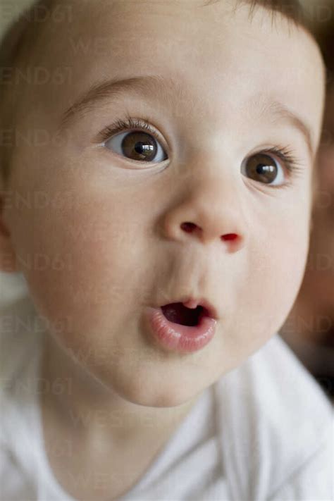 Baby boy making facial expressions stock photo