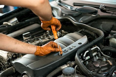 Mechanic Working On Engine - Stock Photos | Motion Array