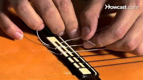 How to Restring a Nylon String Guitar | Guitar Lessons - YouTube