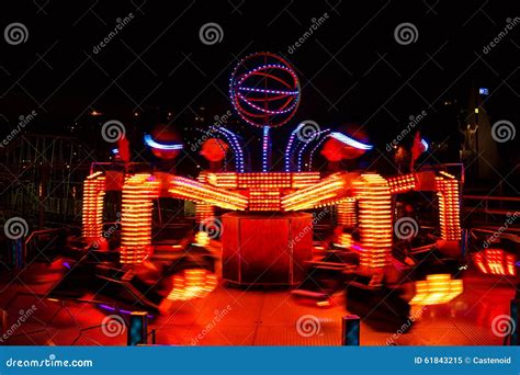 Carousels at night editorial image. Image of bulb, night - 61843215