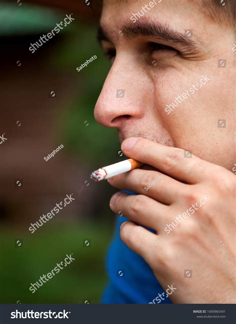 Sad Young Man Smoking Cigarette Closeup Stock Photo 1069965491 ...