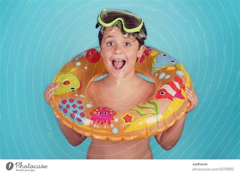 Boy wearing arm floaties in a swimming pool - a Royalty Free Stock ...