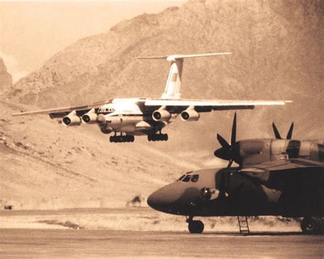 Il-76 landing at Kabul Airport with an An-32 in the foreground. 1980s ...