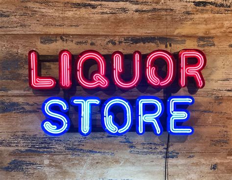 Neon Liquor Store Sign - Kemp London - Bespoke neon signs and prop hire.