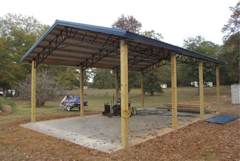 a covered parking lot in the middle of a park