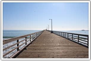 The Avila Beach Pier extends into the ocean from the Avila Promenade