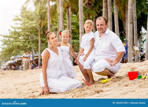 Happy Young Family on the Sunset at the Beach. Stock Photo - Image of ...