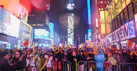 Thousands pack Times Square for soggy New Year's Eve celebrations