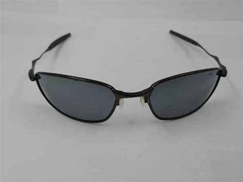 PAIR OF AUTHENTIC OAKLEY SUNGLASSES - Able Auctions