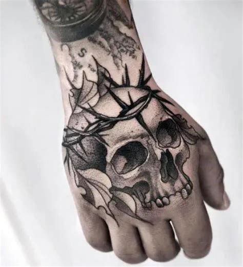 50 Skull Hand Tattoo Designs with Meaning | Art and Design