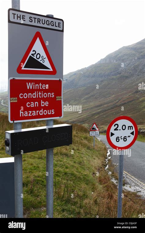 "Kirkstone Pass", [road signs] on steep hill, "Lake District", Cumbria ...