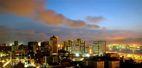 Lagos Skyline at Night with Bright Lights and Clouds