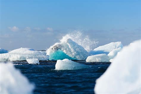 winter icebergs floating on body of water during daytime iceberg Image ...