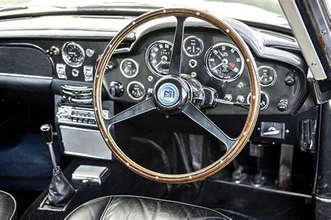 Steering wheel and dashboard of a 1965 Aston Martin DB5