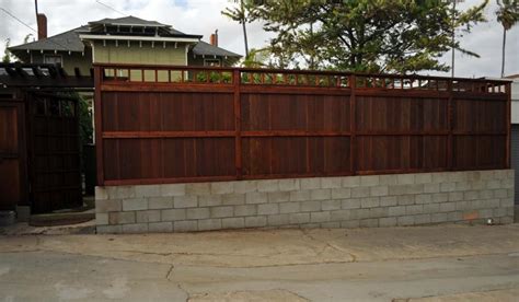 Wooden fence ontop of cinder blocks | Cinder block walls, Cinder block ...