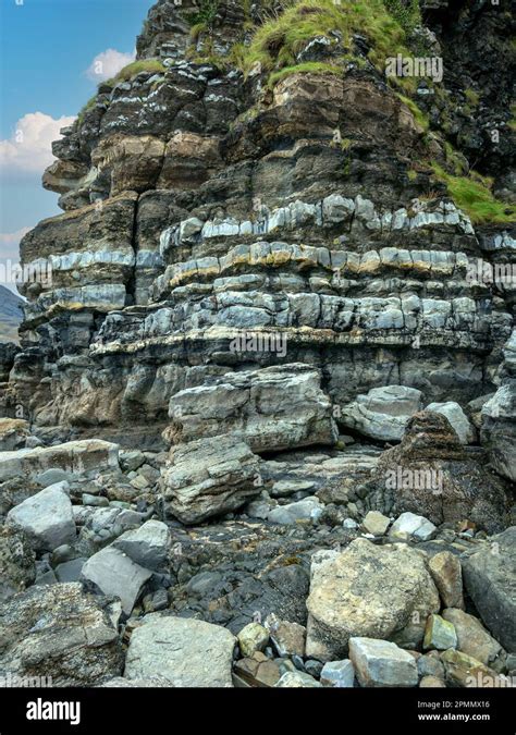 Banded sedimentary rock layers of sandstone, siltstone and mudstone in ...