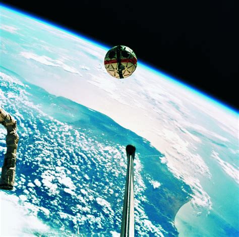 A Satellite In Orbit Around The Earth Photograph by Stockbyte