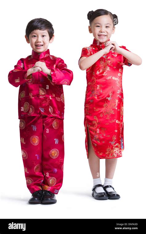 Cute children in traditional clothing celebrating Chinese New Year ...