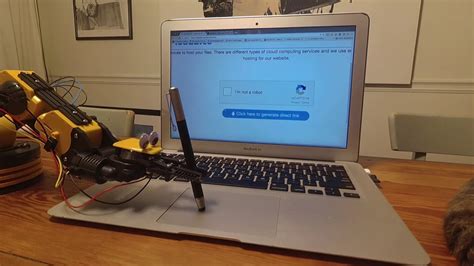 A Robotic Arm Successfully Beats an 'I Am Not a Robot' CAPTCHA Using a ...