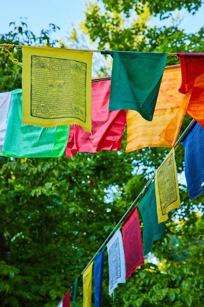 Premium Photo | Buddhist prayer flags in all colors on wire