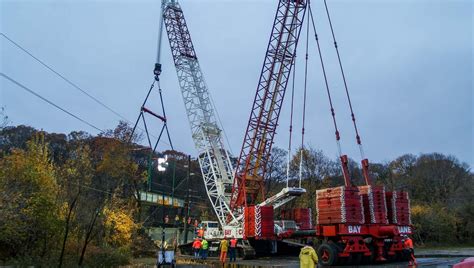 Cranes lifting heavy equipment