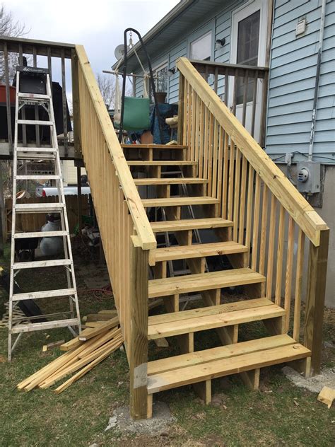 Wooden Staircase Next to a House