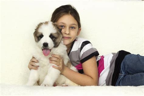 Child hugging a puppy stock image. Image of pets, hugging - 48259535