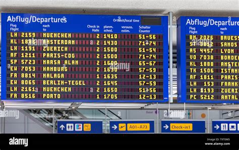 Airport flight information displayed on departure board, flight status ...