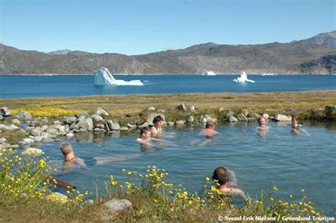 Watch icebergs float by while soaking in a hot spring...in Greenland ...