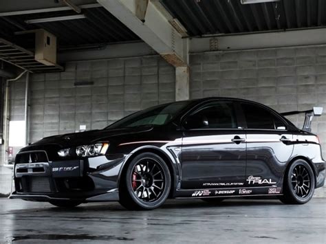 Black Mitsubishi Lancer Evo X in the garage wallpapers and images ...