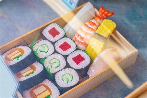 Free Photo | Plastic sushi rolls in a display case