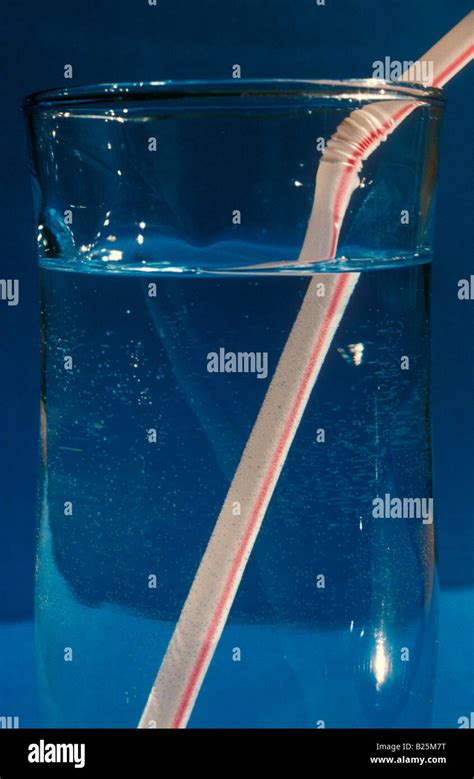 Light refraction glass of water and straw Stock Photo - Alamy