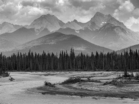 Black and white landscape of the rugged Canadian rocky mountains with a ...