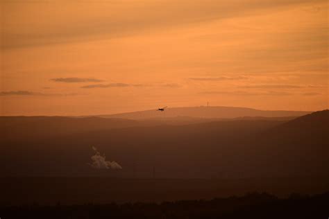 An Airplane Flying over the Mountains · Free Stock Photo