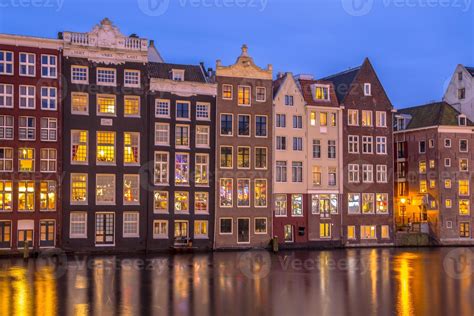 Canal houses on Damrak in Amsterdam 1138207 Stock Photo at Vecteezy