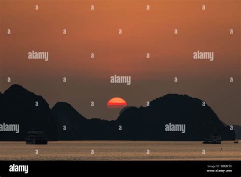 Sunset in the Halong Bay of Vietnam Stock Photo - Alamy