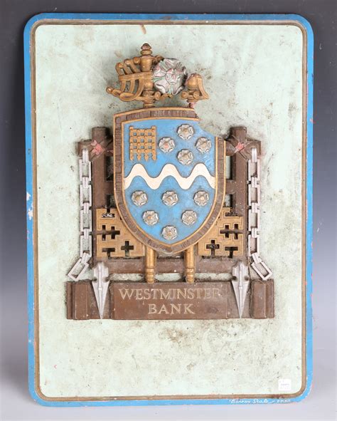 A cast composite wall plaque in the form of the 'Westminster Bank' coat ...