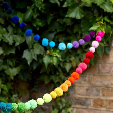 multicoloured pom pom bunting garland by get it rapt ...