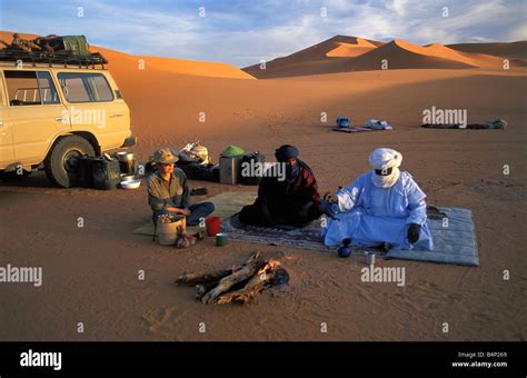 Algeria near Djanet Sanddunes Tourists camping with people of Tuareg ...