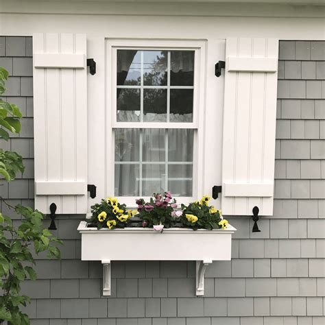 Stained Shutters on Gray House: Elevating Your Home's Curb Appeal