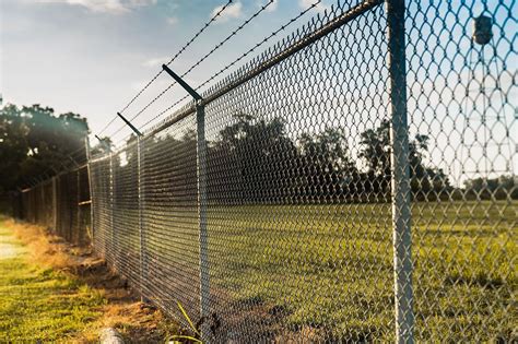 When to Add Barbed Wire to Your Commercial Fencing