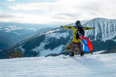 Premium Photo | Full length of woman standing on snow covered mountain