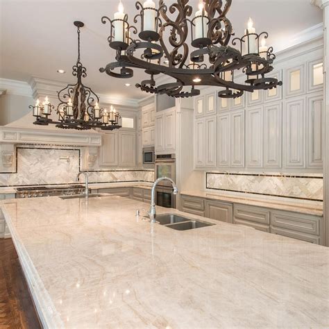 a large kitchen with an island and chandelier