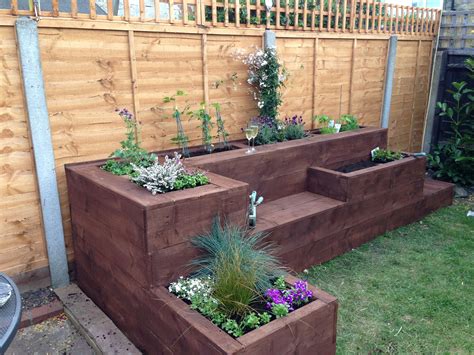 Raised flower bed I would make this out of sleepers but I like the ...