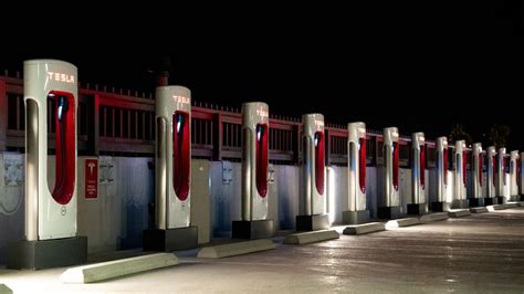 Tesla commits to opening up 7 500 charging stations to other evs by ...