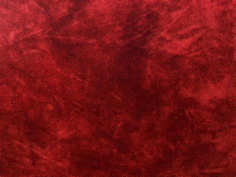 Dark red velvet fabric texture used as background. Empty dark red ...