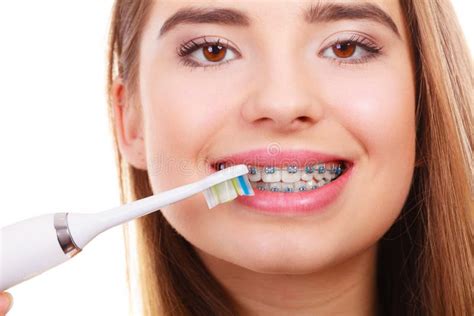 Woman Brushing Teeth with Braces Using Brush Stock Image - Image of ...