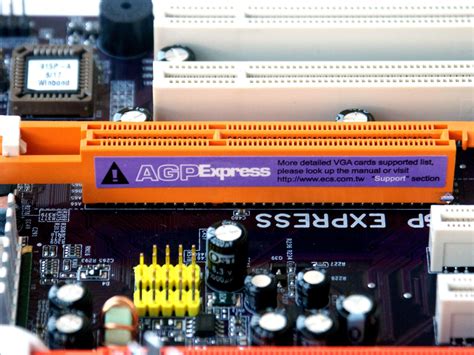 iXBT Labs - Photo of the day: i915-based motherboard with AGP/PCI-E slots