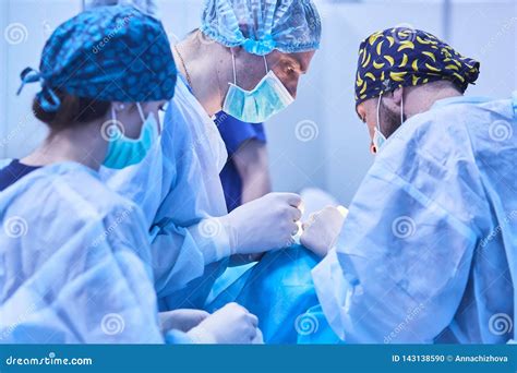 Serious Surgeons during a Surgery in the Hospital. Cross Process Stock ...