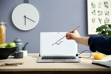 This accessory finally gives your MacBook Air the touchscreen it ...